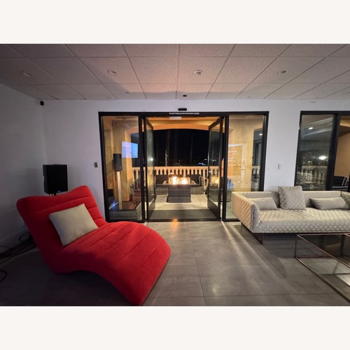 Used Red Fabric Chaise Lounge for sale on AptDeco