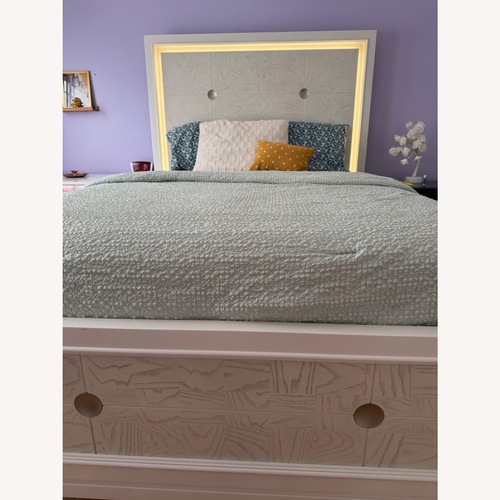Used Raymour & Flanigan Giovanna White Wood Queen Bed for sale on AptDeco