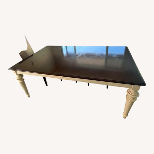 Used Bassett Dark Brown Wood Dining Table for sale on AptDeco