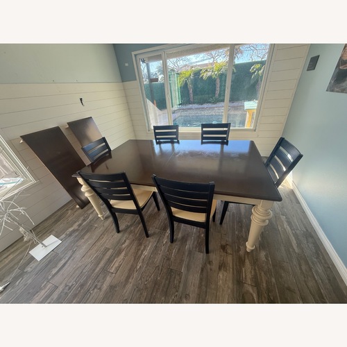 Used Bassett Dark Brown Wood Dining Table for sale on AptDeco