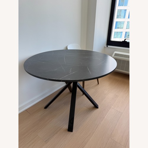 Used IKEA Mariedamm Black Wood Dining Table for sale on AptDeco