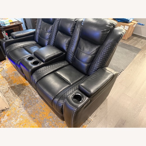 Used Ashley Furniture Party Time Dual Power Reclining Loveseat with Console for sale on AptDeco