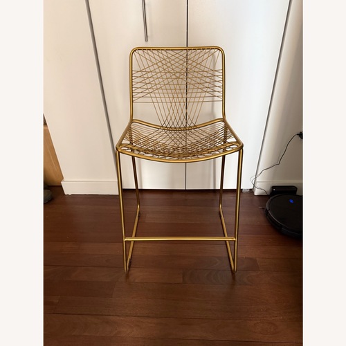 Used CB2 Alpha Gold Brass Dining Chairs for sale on AptDeco