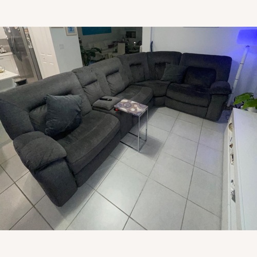 Used Rooms To Go  Dark Gray Fabric 3+ Piece Sectional for sale on AptDeco