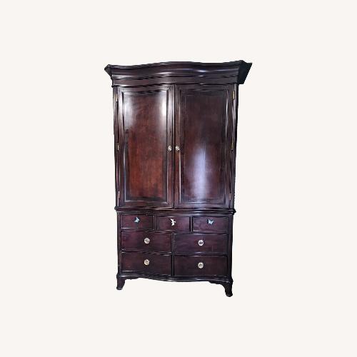 Used Brown Wood Armoire for sale on AptDeco
