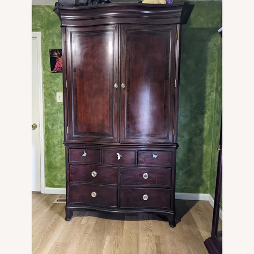 Used Brown Wood Armoire for sale on AptDeco