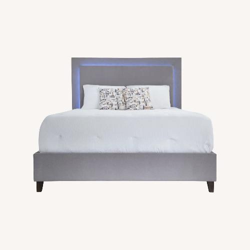 Used Performa Queen Gray Upholstered Panel Bed for sale on AptDeco