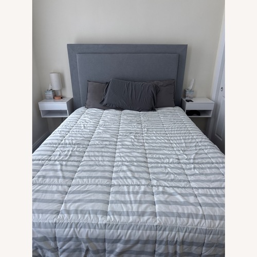 Used Performa Queen Gray Upholstered Panel Bed for sale on AptDeco