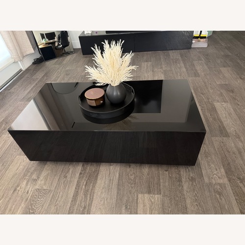 Used Modern Black Glass Coffee Table for sale on AptDeco