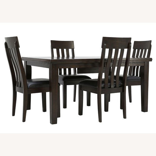 Used Ashley Furniture Haddigan Extendable Dining Table with Chairs for sale on AptDeco