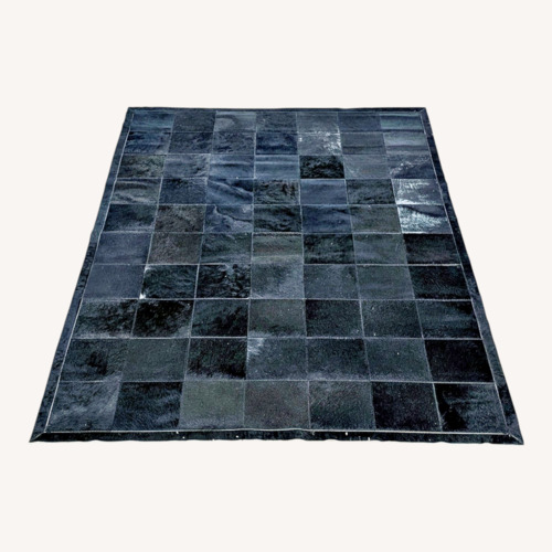 Used Restoration Hardware 5' x 7' Patchwork Cowhide Rug for sale on AptDeco