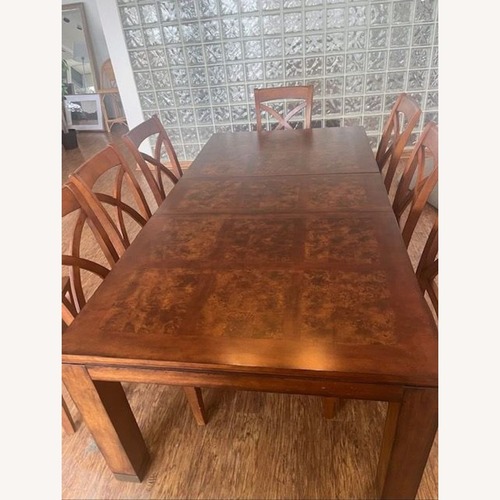 Used Bassett 9-Piece Wooden Extendable Dining Set   for sale on AptDeco