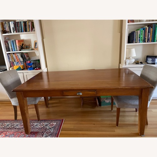 Used Pottery Barn Parker Honey Oak Dining Table for sale on AptDeco