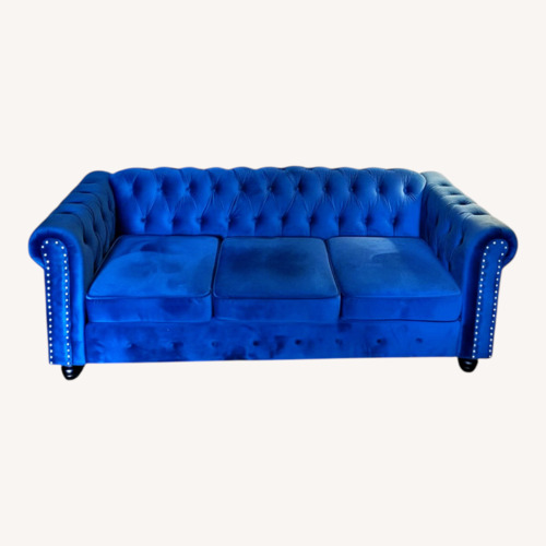 Used SPG Internaional Blue Couch with Silver Hardware and Wooden Legs for sale on AptDeco