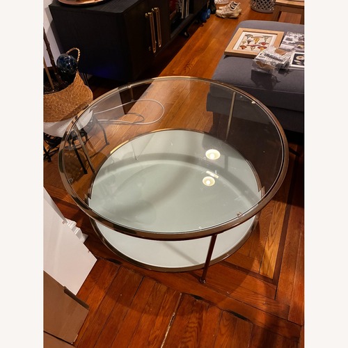 Used Glass and Brass Colored Round Coffee Table for sale on AptDeco
