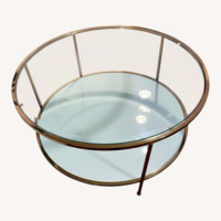 Glass and Brass Colored Round Coffee Table