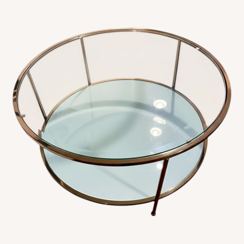 Used Glass and Brass Colored Round Coffee Table for sale on AptDeco