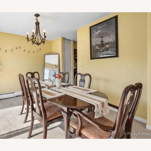 Used Ethan Allen Dark Brown Wood Dining Table for sale on AptDeco