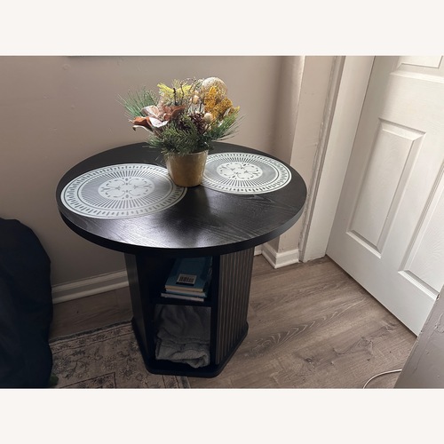 Used Black Wood Dining Table for sale on AptDeco