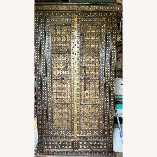 Used Antique Dark Brown Wood Armoire for sale on AptDeco