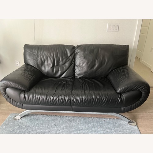 Used Nicoletti Black Leather Loveseat for sale on AptDeco