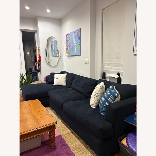 Used Jennifer Convertibles Blue 2 Piece Sectional for sale on AptDeco