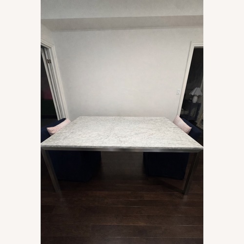 Used Crate & Barrel Parsons White Marble Dining Table for sale on AptDeco
