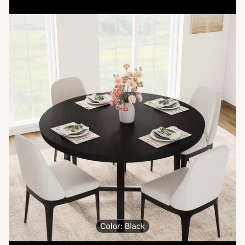 Used Black Wood Dining Table for sale on AptDeco