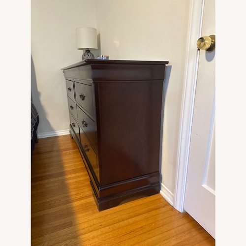 Used Ashley Furniture Alisdair Dark Brown Wood Dresser for sale on AptDeco