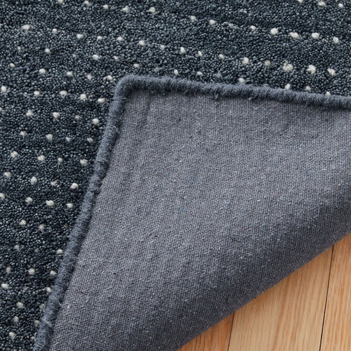 Used West Elm Graduated Dot Navy Wool Area Rug 8' x 10' for sale on AptDeco