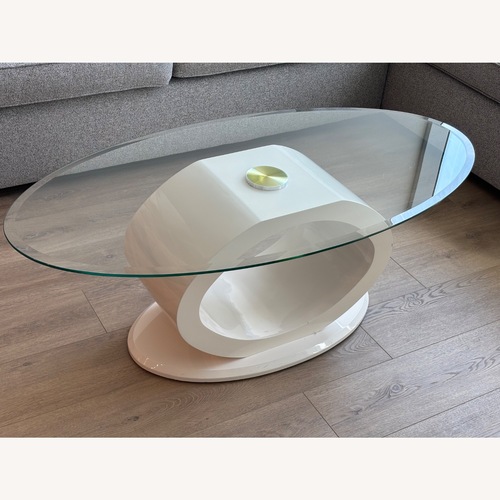 Used Mid Century Modern Oval Glass Coffee Table  for sale on AptDeco