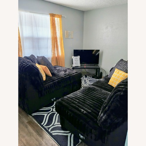 Used Signature Design Black 2 Piece Sectional for sale on AptDeco