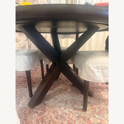 Used Restoration Hardware Black 1960s French X-Base Round Dining Table for sale on AptDeco