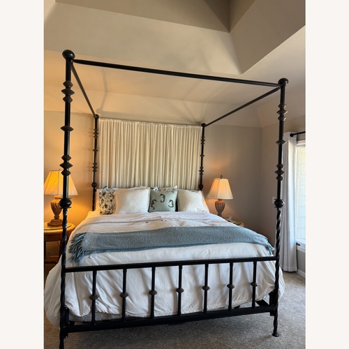 Used Kreiss Canopy Black Iron King Bed for sale on AptDeco