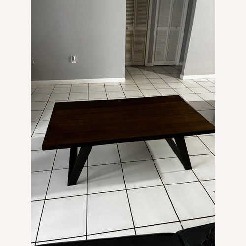 Used Rooms To Go  Aden Dark Brown Wood Coffee Table for sale on AptDeco