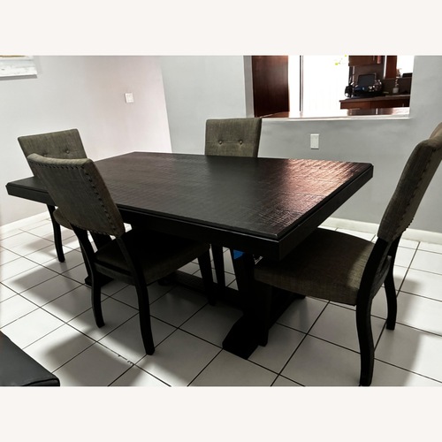 Used Rooms To Go Cindy Crawford Home Westover Hills Black Wood Dining Set for sale on AptDeco