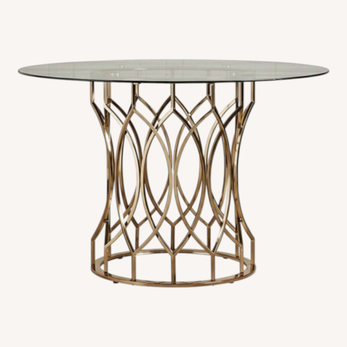 Used Davlin Round Glass Champagne Gold Base Top Dining Table for sale on AptDeco
