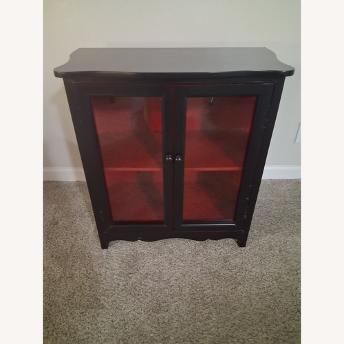 Used Black and Red Small Cabinet W Glass Doors for sale on AptDeco