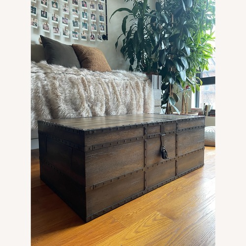 Used Horchow Rustic Mocha Oak Trunk Coffee Table for sale on AptDeco