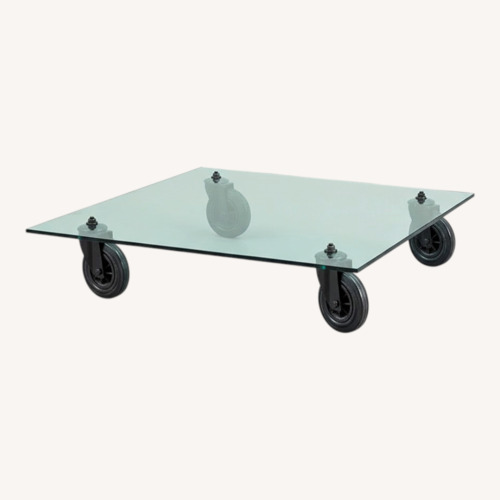 Used Tavolo Con Route Glass Coffee Table for sale on AptDeco