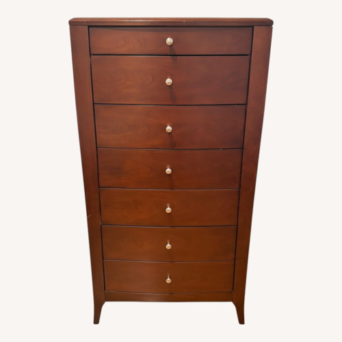 Used Raymour & Flanigan Dark Brown Wood Dresser for sale on AptDeco