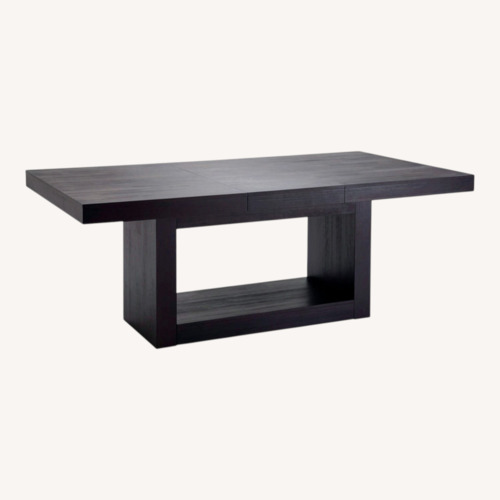 Used Cosmopolitan 60"-100" Extendable Black Wood Dining Table for sale on AptDeco