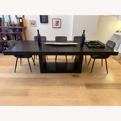 Used Cosmopolitan 60"-100" Extendable Black Wood Dining Table for sale on AptDeco