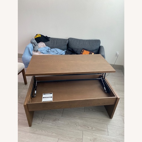 Used IKEA ÖSTAVALL Dark Brown Wood Coffee Table for sale on AptDeco