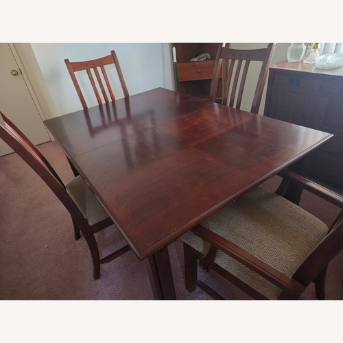 Used Dark Brown Wood Dining Set for sale on AptDeco