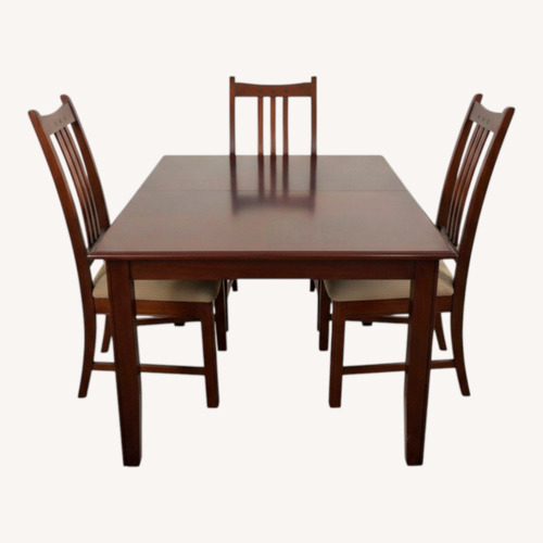 Used Dark Brown Wood Dining Set for sale on AptDeco
