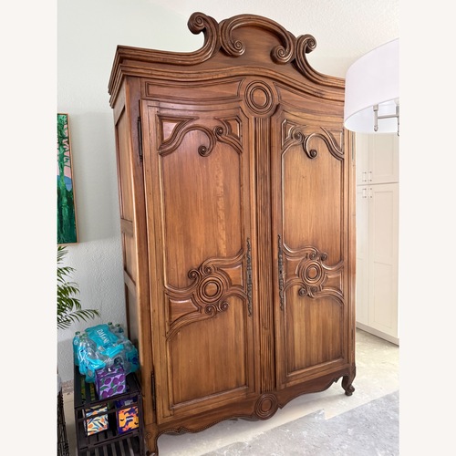 Used Solid Wood Antique Inspired Armoire for sale on AptDeco