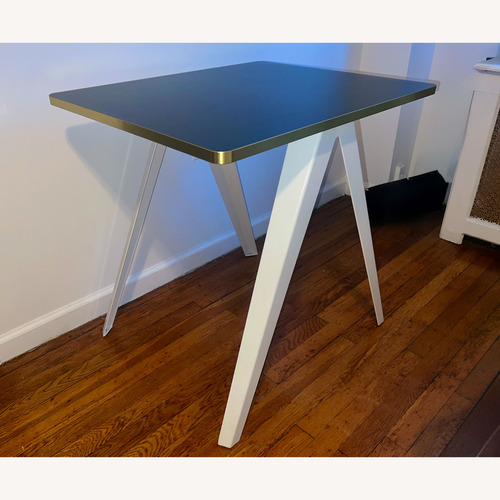 Used Black Stainless Steel Dining Table for sale on AptDeco