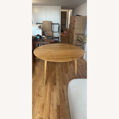 Used Light Brown Wood Dining Table for sale on AptDeco