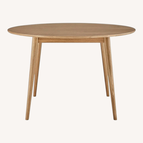 Used Light Brown Wood Dining Table for sale on AptDeco